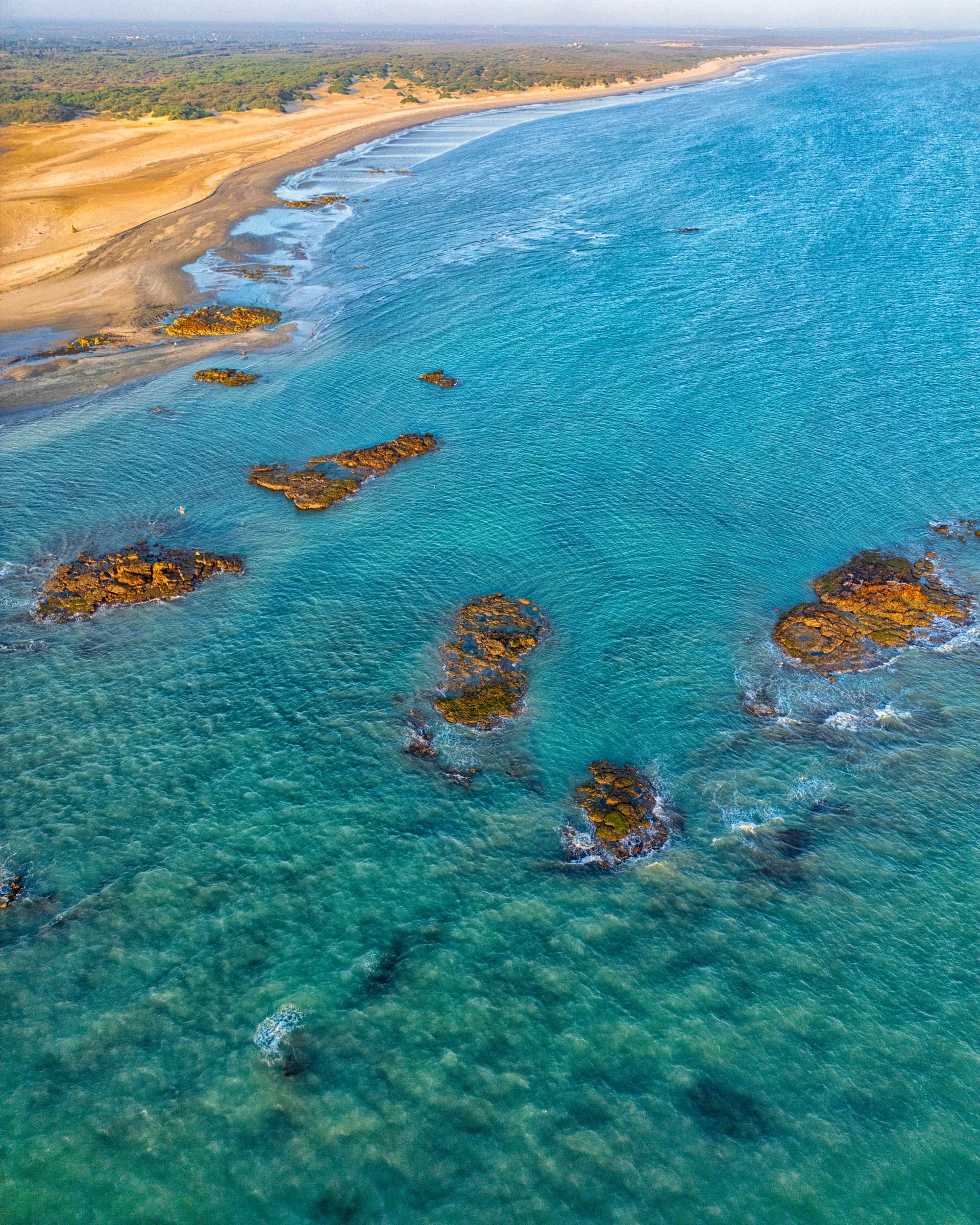 Mandvi Beach aerial view of turquoise Arabian Sea and golden sand