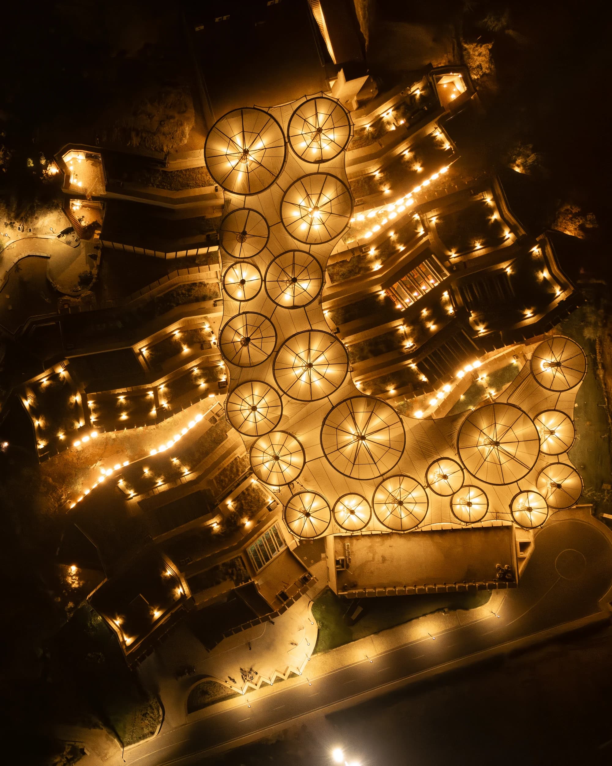 Smritivan Museum illuminated circular roof top-down view at night
