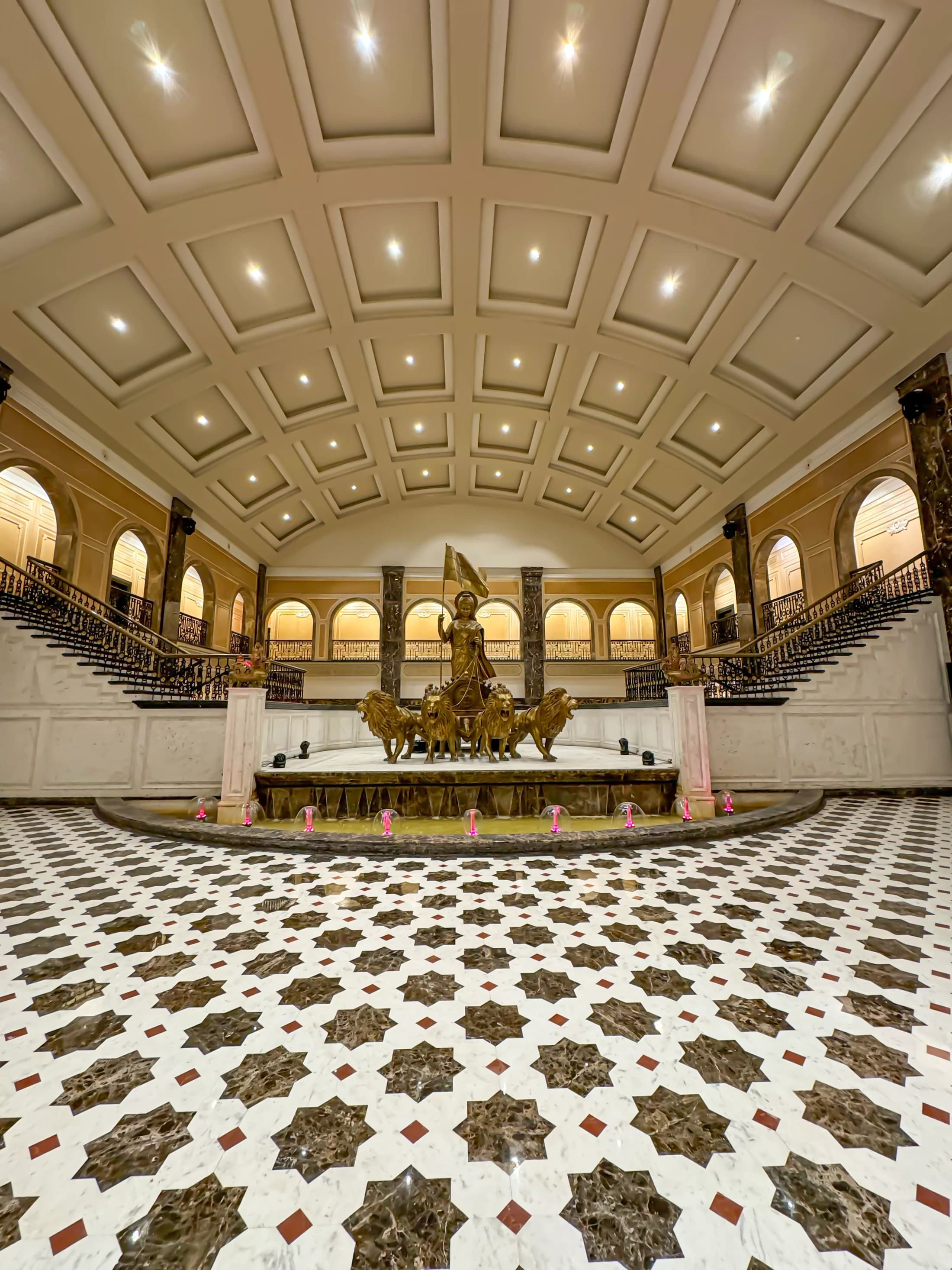 Vande Mataram complex grand interior hall with gold statue and murals