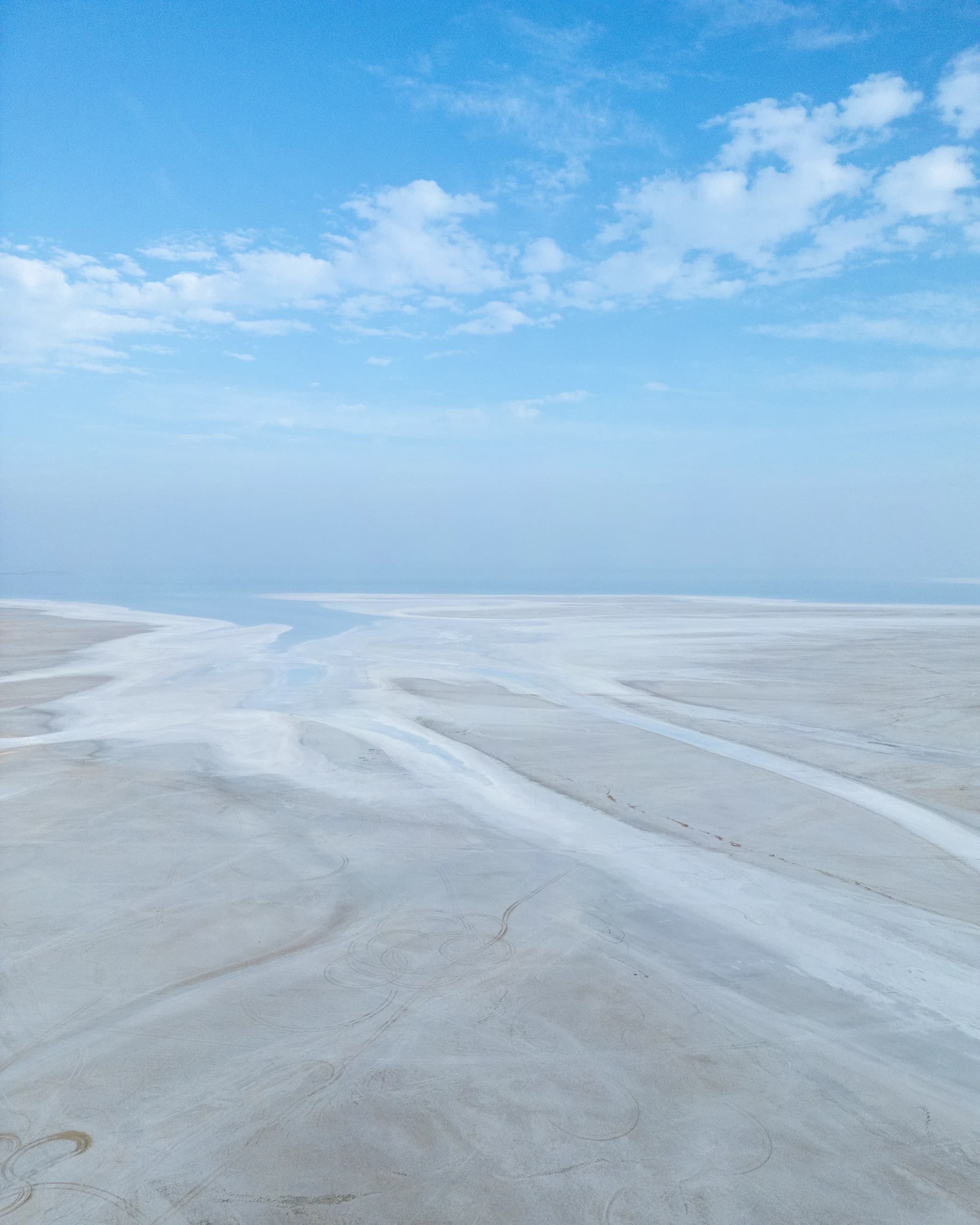 White Rann of Kutch pristine salt flats aerial view with blue sky